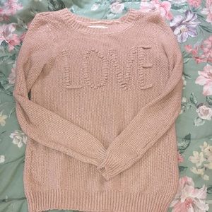 Light pink sweater.